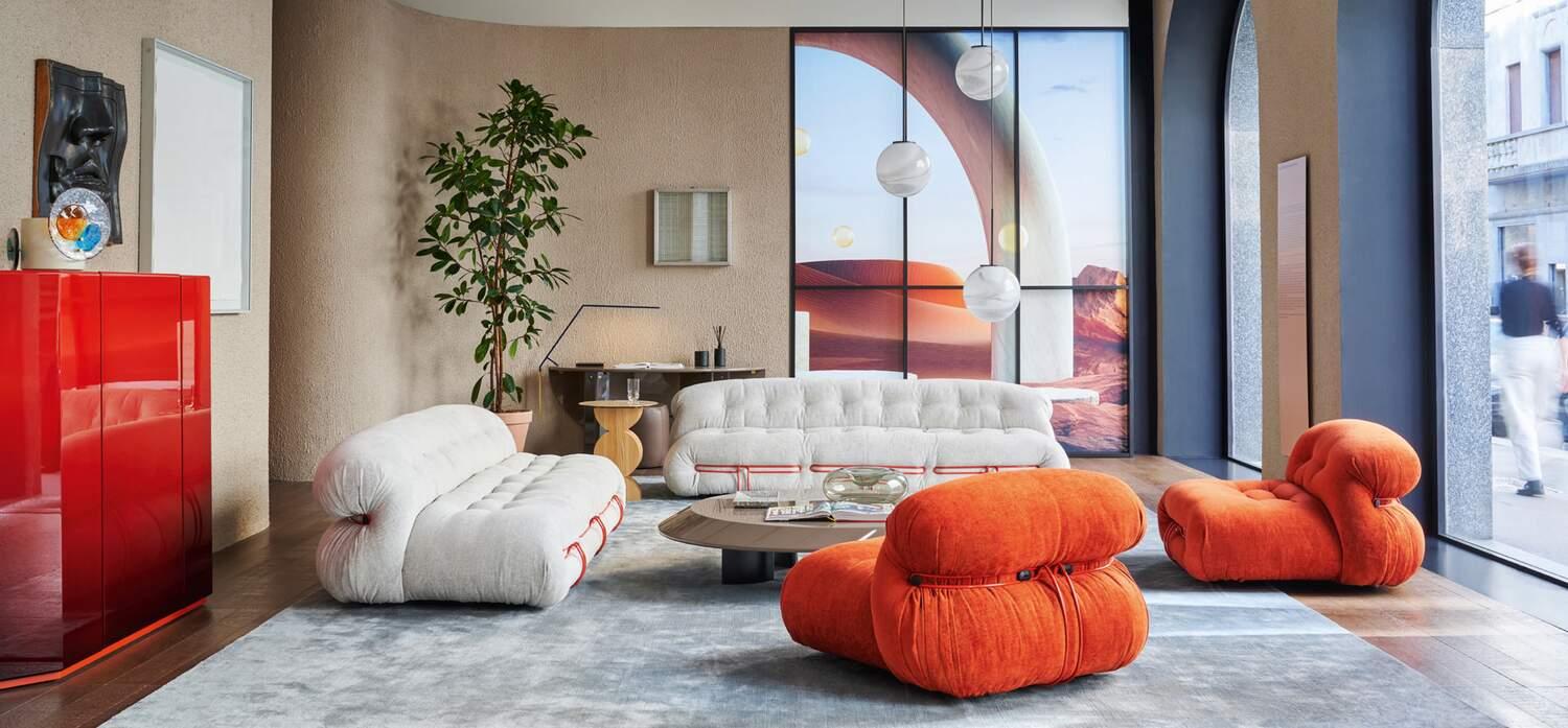 The Soriana sofa in a contemporary interior setting, grey and orange editions