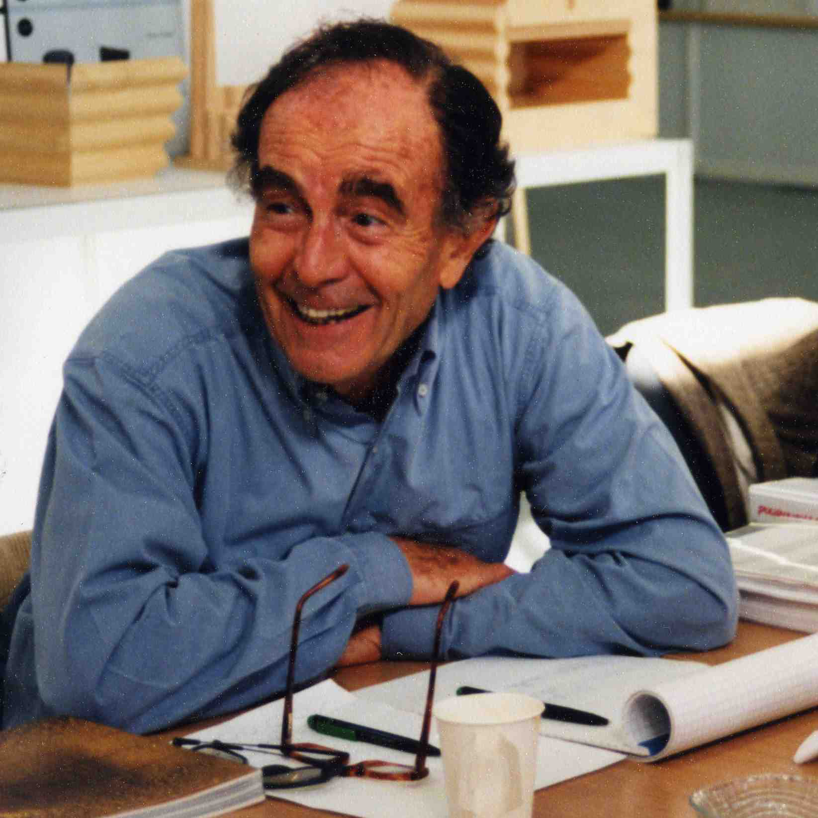Portrait of designer Vico Magistretti at his drawing desk