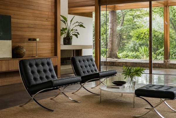 Black leather lounge seating in a timber-lined room. AI-generated image for illustration purposes.