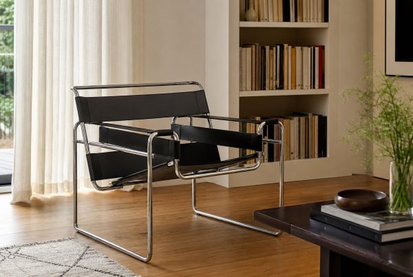 A leather-sling chair beside a bookcase. AI-generated image for illustration purposes.