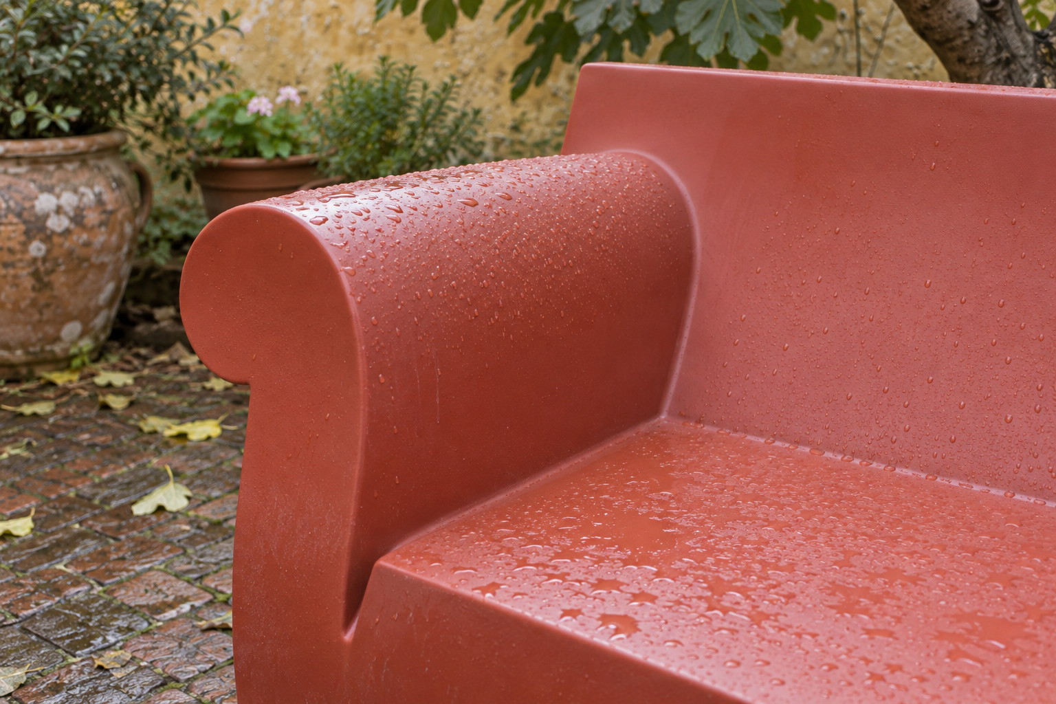 Water droplets on the moulded arm and seat of Bubble Club