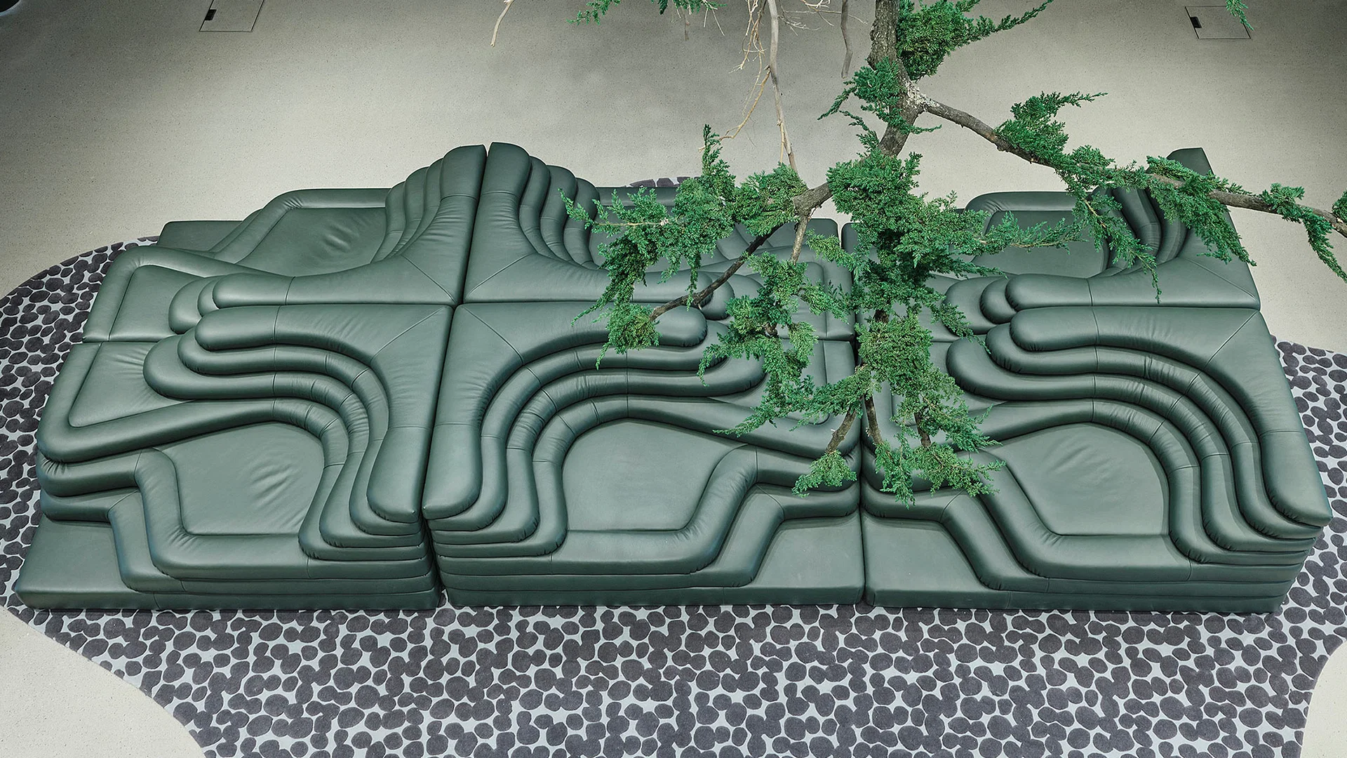 Overhead view of green leather Terrazza modules forming a continuous landscape of curved terraces